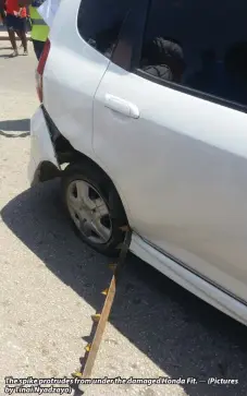  ??  ?? The spike protrudes from under the damaged Honda Fit. — (Pictures by Tinai Nyadzayo)