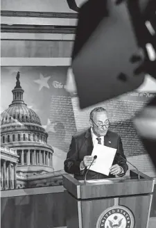  ?? Kenny Holston/New York Times ?? Sen. Chuck Schumer discusses the bill. Political muscle and pleas to Sen. Kyrsten Sinema killed a measure to keep private investment funds in a 15 percent corporate minimum tax status.