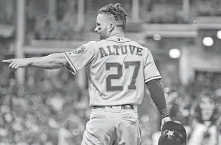  ??  ?? Jose Altuve celebrates after hitting a two-run double off Indians reliever Andrew Miller during the eighth inning Friday night. Altuve finished 2-for-5 and is hitting .308 on the season. David Dermer / Associated Press