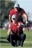  ?? GETTY IMAGES ?? U.S. golfers Brooks Koepka and Brandt Snedeker line up a putt Friday at the Ryder Cup.