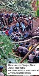  ?? PHOTO BY RANGGA FIRMANSYAH/
AP/REX/SHUTTERSTO­CK ?? Rescuers in Cianjur, West Java, Indonesia