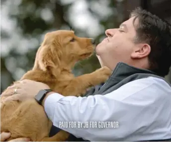  ?? SCREENSHOT ?? Democrat J.B. Pritzker appears with a puppy in his latest ad in the governor’s race.