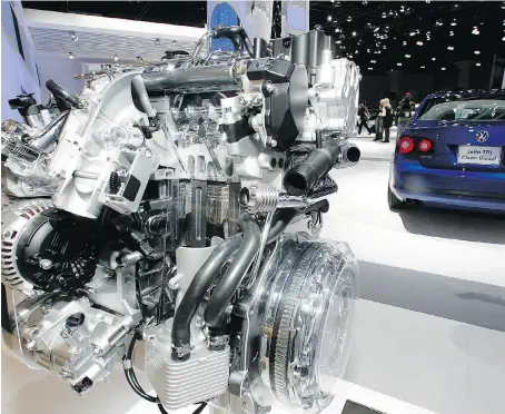  ?? DAMIAN DOVARGANES/THE ASSOCIATED PRESS FILES ?? A Volkswagen Jetta TDI diesel engine is displayed at the 2008 Los Angeles Auto Show. Volkswagen Group Canada has agreed to give cash payouts to drivers affected by the automaker’s diesel emissions-rigging ploy uncovered in September 2015.