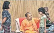  ?? PTI ?? Adityanath meets Vivek Tiwari’s children on Monday.