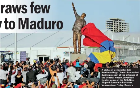  ??  ?? A statue of Venezuela's late President Hugo Chavez is unveiled during an event at the entrance of the Venetur Hotel Convention Center, venue of the 17th NonAligned Summit in Porlamar, Venezuela on Friday. Reuters