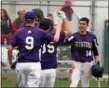  ?? RANDY MEYERS — THE MORNING JOURNAL ?? Keystone’s Cameron Emerick is congratula­ted by teammates after scoring during the top of the seventh inning against Firelands on April 3.