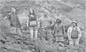  ??  ?? Johnson, center, stars in “Jumanji: Welcome to the Jungle” with Nick Jonas, Karen Gillan, Kevin Hart and Jack Black. It’s in theaters now. NIKO TAVERNISE