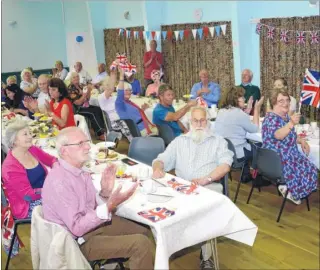  ?? Picture: Paul Amos FM4377147/ FM4377144 ?? WI ladies lead the singing while excited guests join in the festivitie­s at Aldington village hall