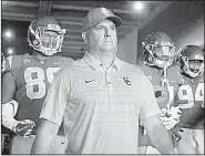  ?? AP/JAE C. HONG ?? The No. 4 Southern Cal Trojans, led by Coach Clay Helton (middle), have won 11 consecutiv­e games, including last season’s Rose Bowl.