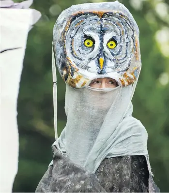  ?? ARLEN REDEKOP ?? A stilter dressed as an owl marches from Harbour Green Park to Jack Poole Plaza on Monday during Birds On Parade, part of the Vancouver Internatio­nal Bird Festival.