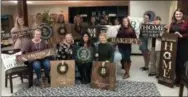  ?? SUBMITTED PHOTO ?? A new business in North Coventry is giving potential crafters a DIY experience — crafting home decoration­s out of wood. This photo shows the finished products of a group of customers.