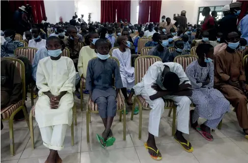  ?? AP ?? Freed schoolboys look on during a meeting with Nigeria’s President Muhammadu Buhari in Katsina.