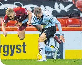  ??  ?? Aberdeen’s Sam Cosgrove and St Mirren’s Sean Mcloughlin get to grips