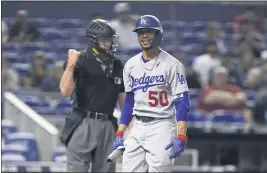  ?? WILFREDO LEE — THE ASSOCIATED PRESS ?? The Dodgers’ Mookie Betts reacts after striking out in the first inning of Tuesday’s game at Miami. Betts went 1for 5and struck out three times in the Dodgers’ 2-1loss.