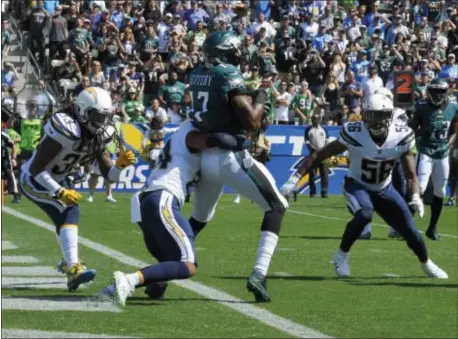 ?? THE ASSOCIATED PRESS — MARK J. TERRILL ?? Eagles wide receiver Alshon Jeffery hauls in a touchdown last Sunday against the Chargers. But the offseason acquisitio­n had just three catches in the Eagles’ 26-24 win and faces a sterner test this week against All-Pro cornerback Patrick Peterson.