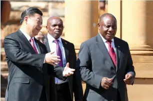  ?? — Reuters ?? China’s President Xi Jinping walks with South African President Cyril Ramaphosa before their media conference in Pretoria, South Africa.