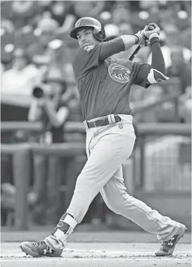  ?? JOE CAMPOREALE/USA TODAY SPORTS ?? Cubs rookie outfielder Albert Almora Jr. had two hits, including a grand slam, against the Rangers during Sunday’s spring training game at Surprise Stadium.
