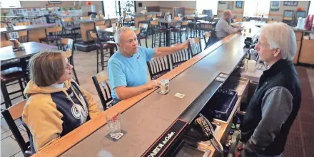  ?? WM. GLASHEEN/USA TODAY NETWORK-WISCONSIN ?? Lea and Jim “Yogi” Vandenberg sit at the 5th Quarter sports bar Thursday in Little Chute. “We had triple the crowd for the Brewers games that we had for the Packers game,” says owner Jerry Watson.