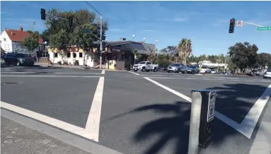  ?? SUSAN KOSWAN SPECIAL TO WATERLOO REGION RECORD ?? A scramble intersecti­on in Carlsbad Village, California, allows all pedestrian­s to cross at the same time. It’s an idea worth considerin­g in Waterloo Region, writes Susan Koswan.