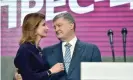  ??  ?? The outgoing president, Petro Poroshenko, embraces his wife, Maryna, on Sunday. Photograph: Sergei Supinsky/AFP/ Getty Images