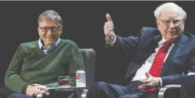  ?? (Shannon Stapleton/Reuters) ?? WARREN BUFFETT, chairman and CEO of Berkshire Hathaway, speaks while Bill Gates looks on at Columbia University in New York in 2017.