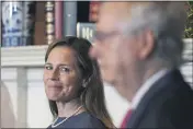  ?? POO — SUSAN WALSH ?? Supreme Court nominee Judge Amy Coney Barrett looks over at Senate Majority Leader Mitch McConnell of Kentucky as they meet with on Capitol Hill in Washington.