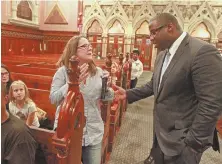  ?? Staffphoto­bystuartca­hill ?? REACHING OUT: Mayoral candidate Tito Jackson speaks with Rebecca Carey of the South End on the homeless/ opioid problem at the Old South Church yesterday.