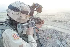  ?? AFP ?? A US soldier keeps a close lookout for suspected Taliban fighters in violencewr­acked Zabul province southwest of the Afghan capital Kabul.