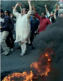  ?? AP ?? Supporters of Imran Khan demonstrat­e against the government of Nawaz Sharif in Lahore. —