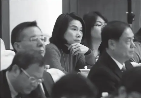  ?? Photo :IC ?? Dong Mingzhu, a deputy to the First Session of the 13th National People’s Congress and chairwoman of Gree Electric Appliances Inc, attends a plenary meeting on the Government Work Report in Beijing on Tuesday. Dong has urged raising the threshold for...