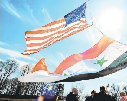  ?? APRILBARTH­OLOMEW/THE MORNING CALL ?? American and Syrian flags being raised to mark Syria Independen­ce Day. Allentown is home to one of the largest Syrian American communitie­s in the United States.