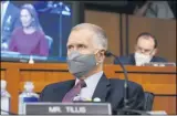  ?? SUSAN WALSH — THE ASSOCIATED PRESS ?? Sen. Thom Tillis, R-N.C., listens to Supreme Court nominee Amy Coney Barrett during her confirmati­on hearing before the Senate Judiciary Committee, Tuesday, Oct. 13, on Capitol Hill.