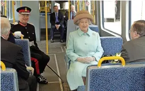  ?? ?? ■ Queen Elizabeth on the new Sunderland to Newcastle Metro link after officially opening it at the Park Lane interchang­e, Sunderland, on May 7, 2002