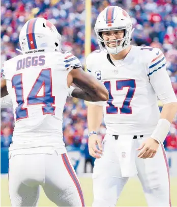  ?? ELSA/GETTY ?? Josh Allen, right, and Stefon Diggs gave the Bills’ offense a big boost after a brutal loss to the Jaguars.