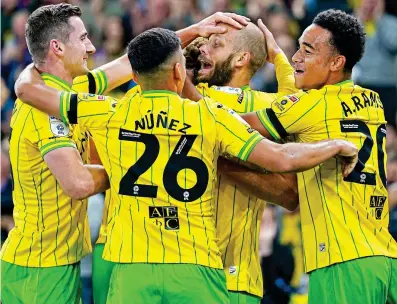  ?? PA ?? Dream Teemu: Pukki celebrates with team-mates after putting Norwich 1-0 ahead