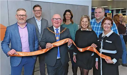  ?? Jon Craig Photos ?? Mayor of Bath Rob Appleyard, opens the new Smartbear office along with (from left) Paramount sales director Kevin Mashford and Smartbear’s chief product officer Dan Faulkner, global talent acquisitio­n and culture vice president Nikki Morcom, brand and corporate communicat­ions senior vice president Maureen Plowman, Bath-based senior director of engineerin­g Mark Fullbrook and vice president of internatio­nal finance Mary Quinn