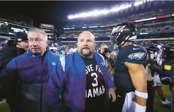  ?? ROURKE/AP
MATT ?? New York Giants head coach Brian Daboll walks on the field after a game against the Eagles on Sunday in Philadelph­ia.