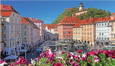  ??  ?? Cocktail time: Graz’s main square sits elegantly in front of the Schlossber­g mountain