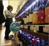  ?? NG HAN GUAN — THE ASSOCIATED PRESS ?? In this file photo, wine imported from the U.S. is displayed at a supermarke­t in Beijing.