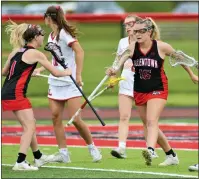  ?? KYLE FRANKO — TRENTONIAN PHOTO ?? Allentown’s Jolee Roth, right, celebrates her goal with teammate Emily Ciccarone, left, against Lawrencevi­lle during the Mercer County Tournament girls lacrosse final on Friday evening at Allentown High. See trentonian. com/sports for more.