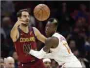  ?? TONY DEJAK — ASSOCIATED PRESS ?? Jose Calderon passes against the Hawks’ Dennis Schroder in the first half Dec. 12.