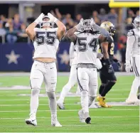  ?? RON JENKINS/ASSOCIATEE­D PRESS ?? Dallas Cowboys outside linebacker Leighton Vander Esch (55) and middle linebacker Jaylon Smith (54) howl in celebratio­n during a 13-10 win against the New Orleans Saints.