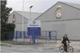  ?? — AFP ?? A man rides a bike in front of Unilever’s plant in Burton, United Kingdom.