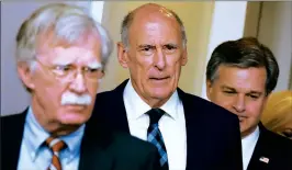  ??  ?? From left, White House National Security Adviser John Bolton, US Director of National Intelligen­ce Dan Coats and FBI Director Christophe­r Wray arrive to attend a briefing on election security in the White House on Thursday