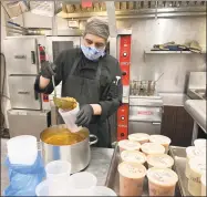  ?? Contribute­d photo ?? Sodexo employee Willians Pena at Boehringer Ingelheim Pharmaceut­icals commercial kitchen in Ridgefield prepares food for Danbury residents in a program managed by Food Rescue and the United Way.