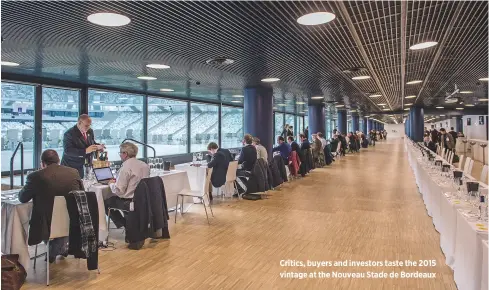  ??  ?? Critics, buyers and investors taste the 2015 vintage at the Nouveau Stade de Bordeaux