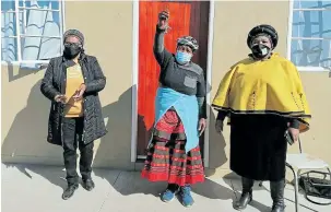  ??  ?? ANSWERED PRAYER: 87-year-old Sterksprui­t grandmothe­r Nondlela Mafirivane, middle, proudly holding keys to her new RDP house. She is flanked by EC human settlement­s MEC Nonkqubela Pieters, left, and Senqu mayor Nomvuyo Mphoselwa