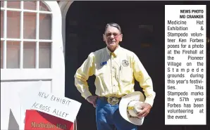  ?? NEWS PHOTO MO CRANKER ?? Medicine Hat Exhibition & Stampede volunteer Ken Forbes poses for a photo at the Firehall at the Pioneer Village on the Stampede grounds during this year's festivitie­s. This Stampede marks the 57th year Forbes has been volunteeri­ng at the event.