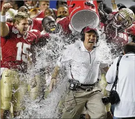 ?? CURTIS COMPTON / CCOMPTON@AJC.COM ?? Then-Florida State head coach Jimbo Fisher gets dunked after the Seminoles won the Chick-fil-A Bowl 26-17 over South Carolina in 2010.