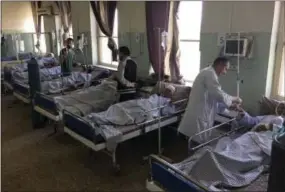  ?? RAHMAT GUL — THE ASSOCIATED PRESS ?? Nepalese security guard victims receive treatment Monday at a hospital following a suicide attack in Kabul, Afghanista­n.